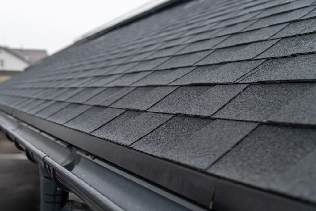 Dark gray asphalt roof shingles